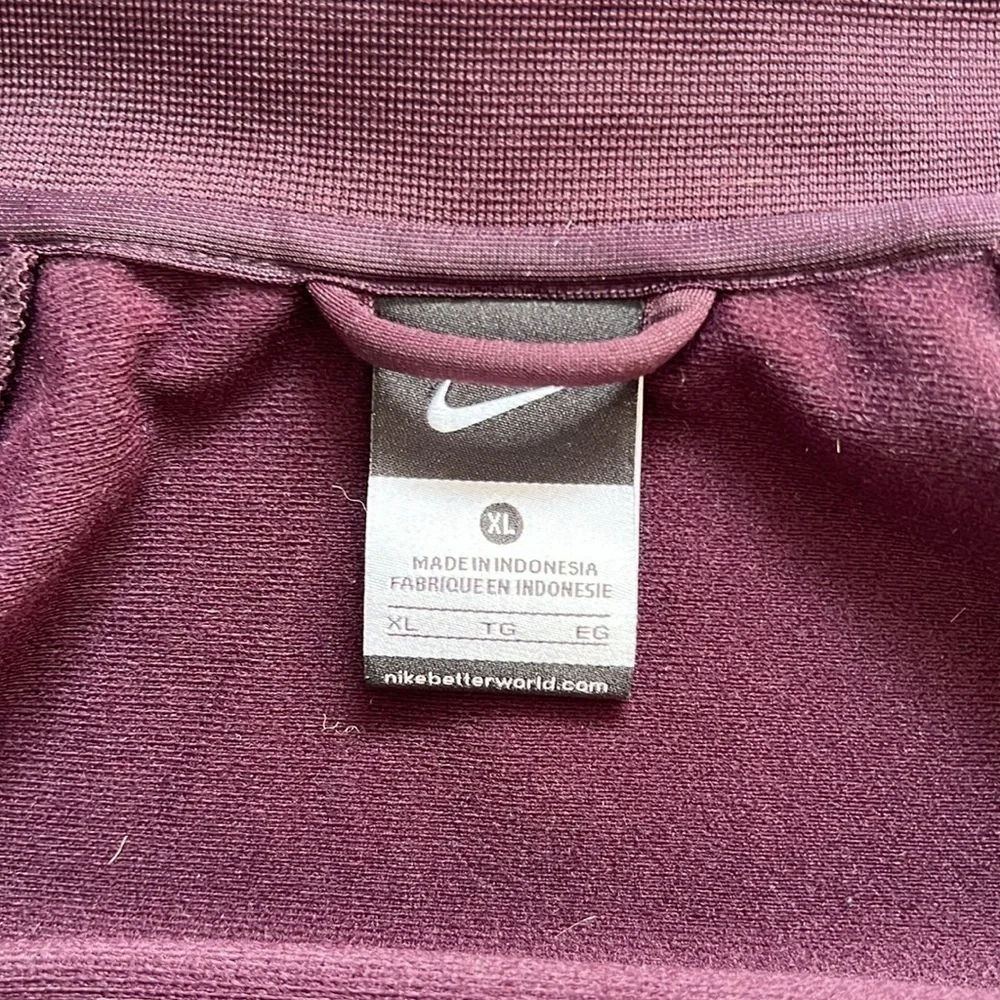 Maroon Nike Jacket size XL Youth black and orange detailing fits womens M/L